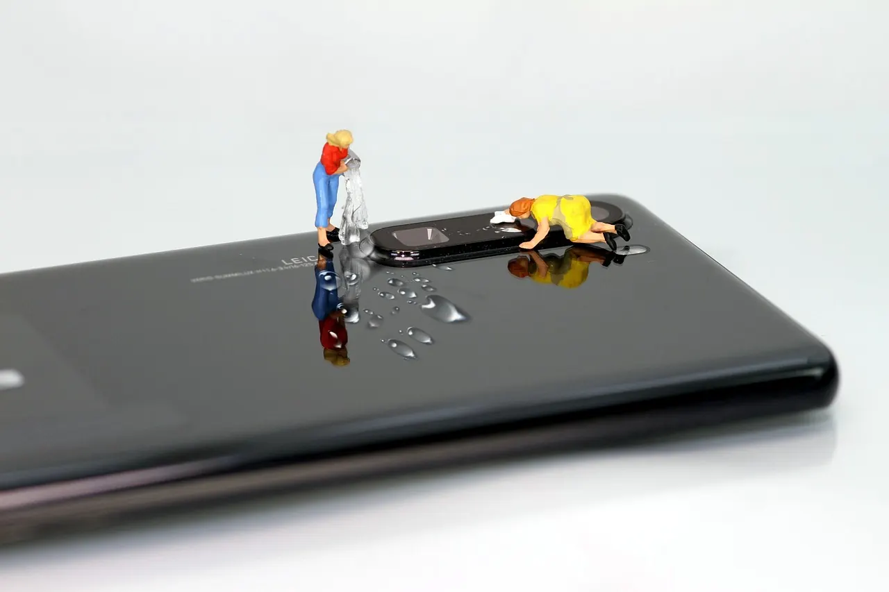 Smartphone camera lens and miniature repair figures